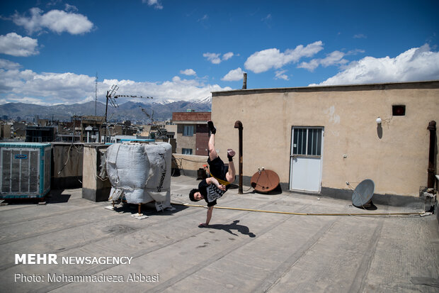 Iranians working out on rooftops amid the pandemic