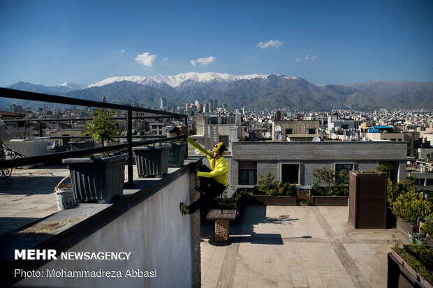 Iranians working out on rooftops amid the pandemic