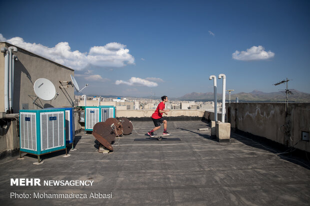 Iranians working out on rooftops amid the pandemic