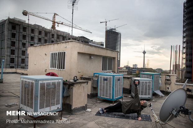 Iranians working out on rooftops amid the pandemic