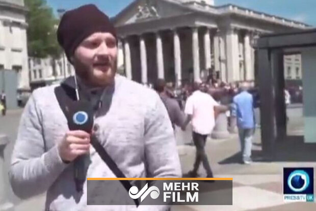 Press TV kanalı muhabiri Londra'daki protestolar sırasında saldırıya uğradı