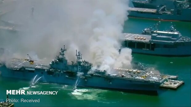 انفجار و آتش سوزی در یک فروند ناو جنگی آمریکا