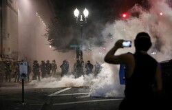 US federal agents fire tear gas on peaceful protesters