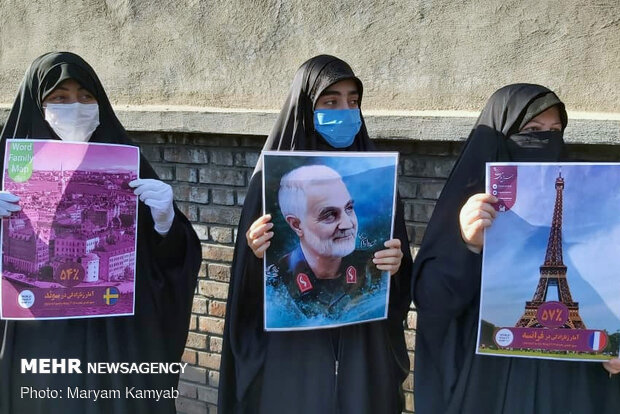 People in Tehran protest in front of French embassy