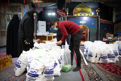 Distributing food assistance packages on eve of Yalda Night