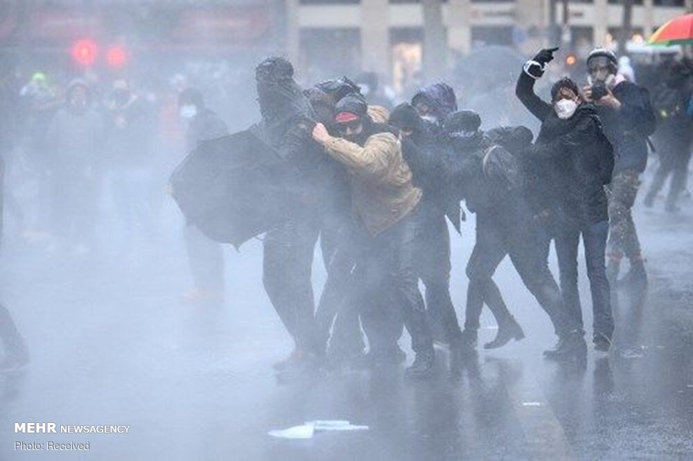 French police attack protesters in Paris on new security law 