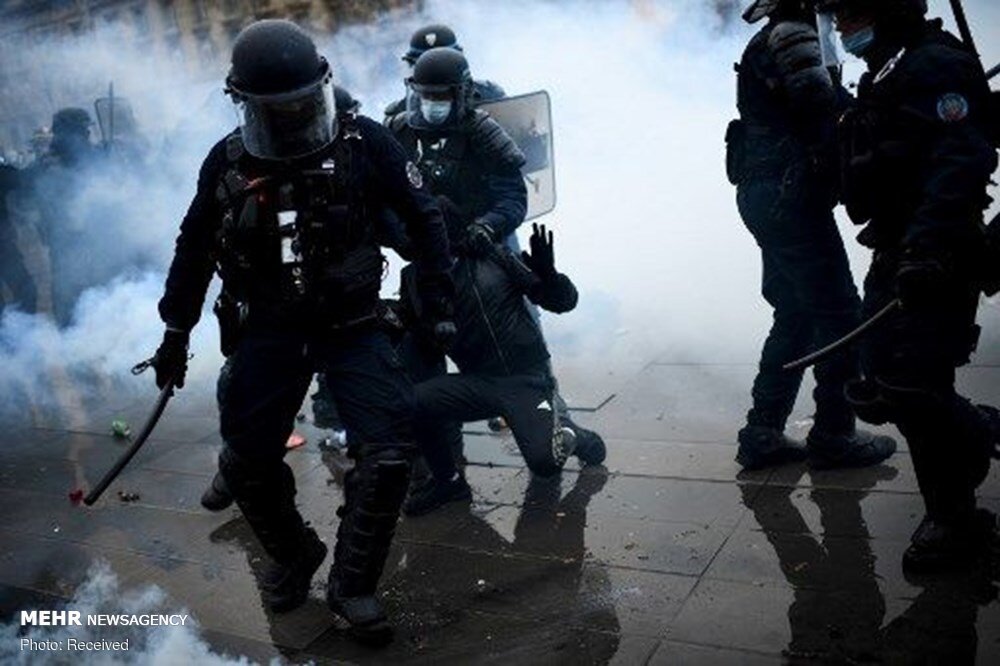 French police attack protesters in Paris on new security law 