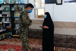 مادر اولین شهید مدافع حرم استان بوشهر تجلیل شد