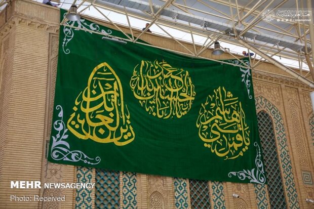 Imam Ali’s holy shrine ornamented with flowers
