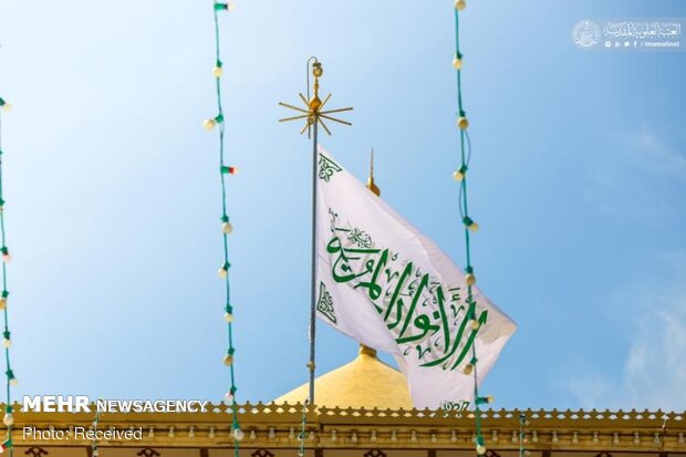 Imam Ali’s holy shrine ornamented with flowers
