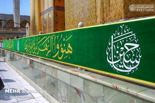 Imam Ali’s holy shrine ornamented with flowers
