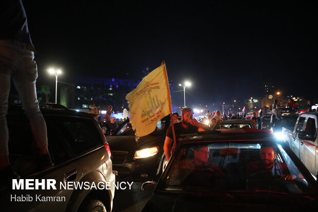 Syrian people celebrating victory of Bashar Asad in election