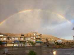 Summer rainfall and rainbow in Baneh