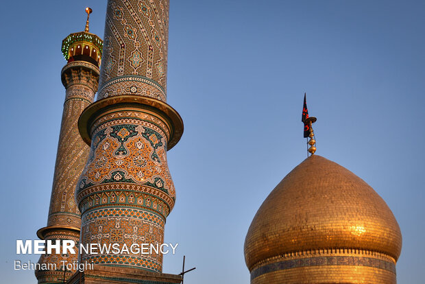Imam Hussein flag raised up above Shah Abdol-Azim Shrine