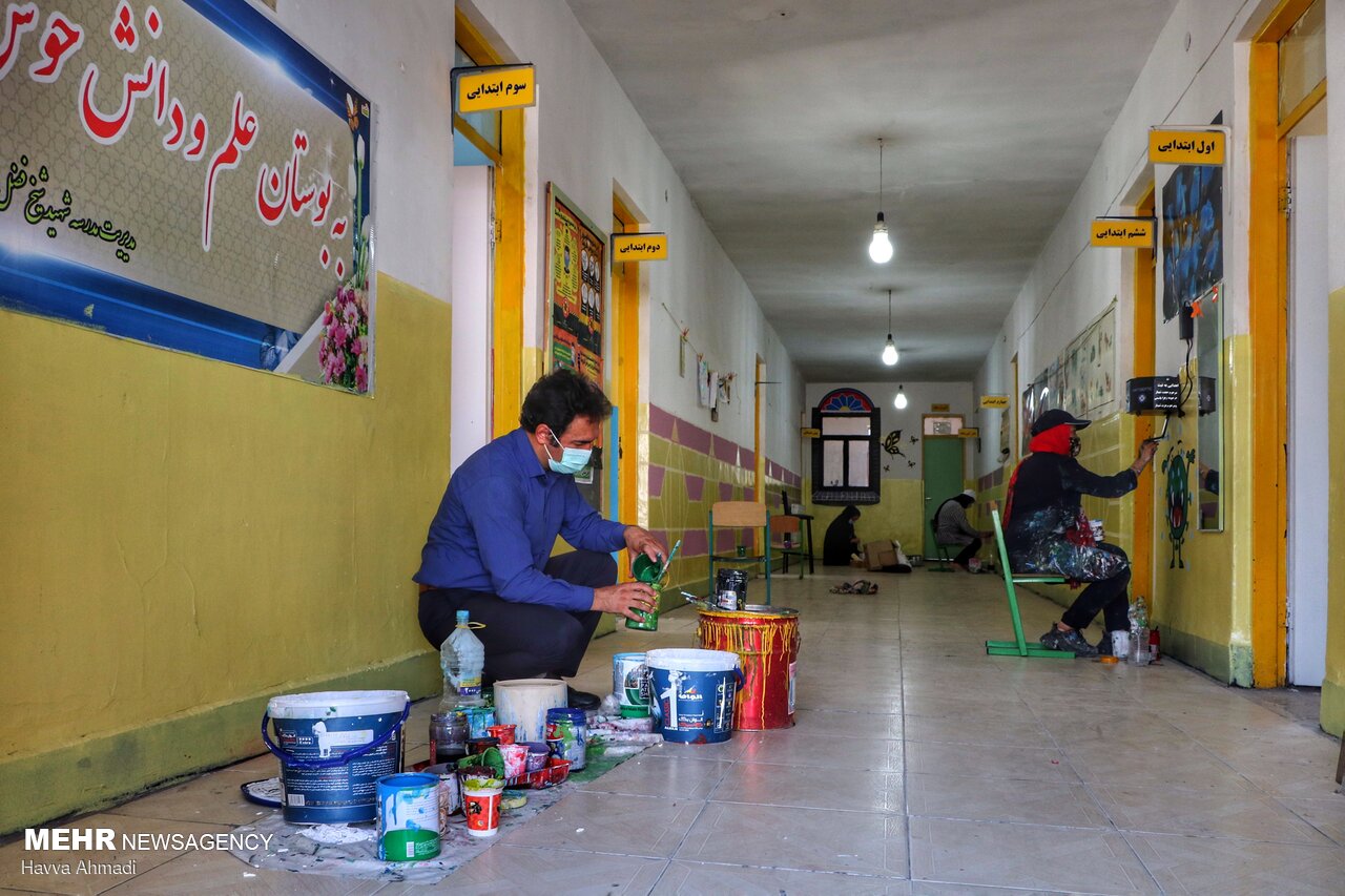 Local artists paint school walls before schools re-open