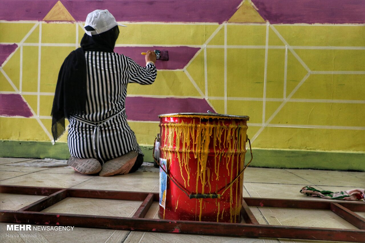 Local artists paint school walls before schools re-open