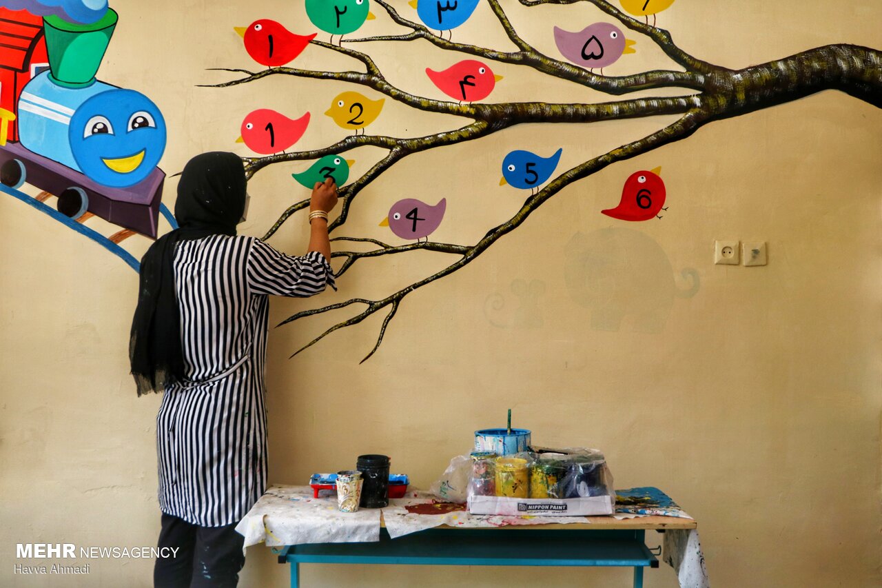 Local artists paint school walls before schools re-open