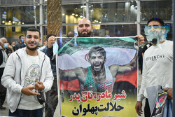 Iranian Greco-Roman wrestling team arrive home