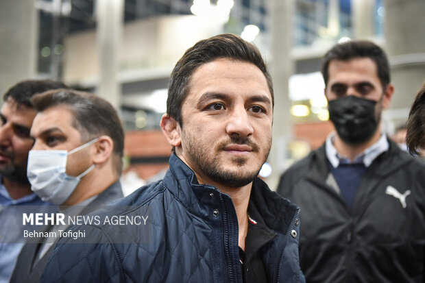 Members of Iranian Greco-Roman wrestling team arrive at home
