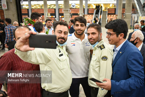 Members of Iranian Greco-Roman wrestling team arrive at home
