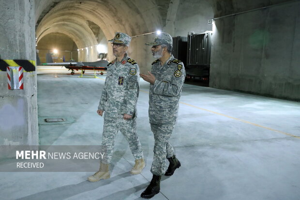 Iranian defense officials visit secret UAV base
