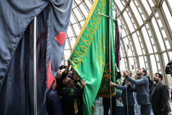 Flag of Imam Reza (PBUH) holy shrine installed at Milad Tower