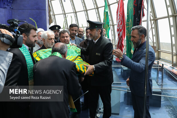 Flag of Imam Reza (PBUH) holy shrine installed at Milad Tower