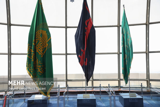 Flag of Imam Reza (PBUH) holy shrine installed at Milad Tower