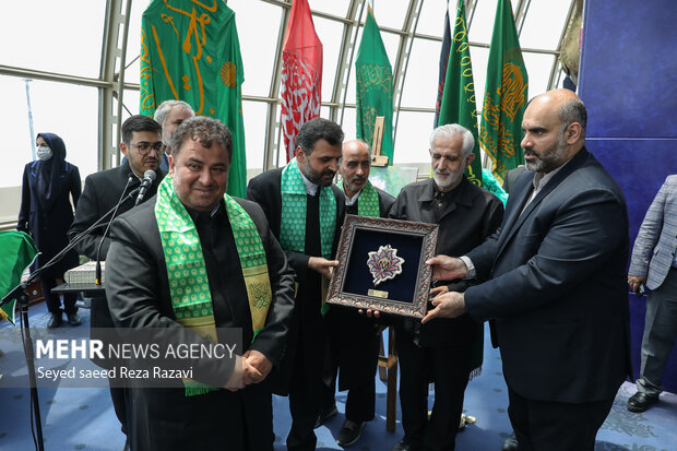 Flag of Imam Reza (PBUH) holy shrine installed at Milad Tower