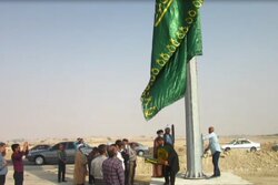 برافراشتن پرچم حرم امام رضا (ع) در شهرستان دیر