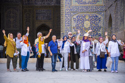 Tourists visit Isfahan historical buildings