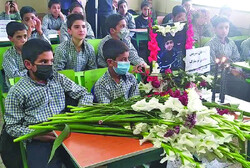 Classmates lay flowers in memory of Arsham