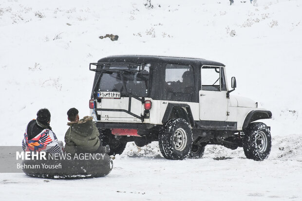 People of Arak enjoy snow tubing
