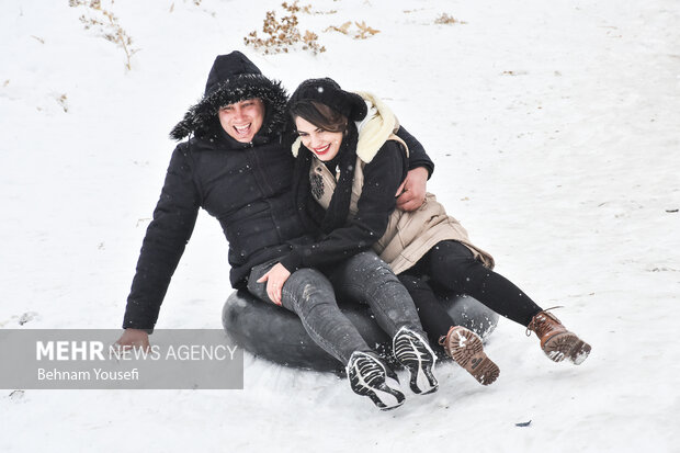 People of Arak enjoy snow tubing
