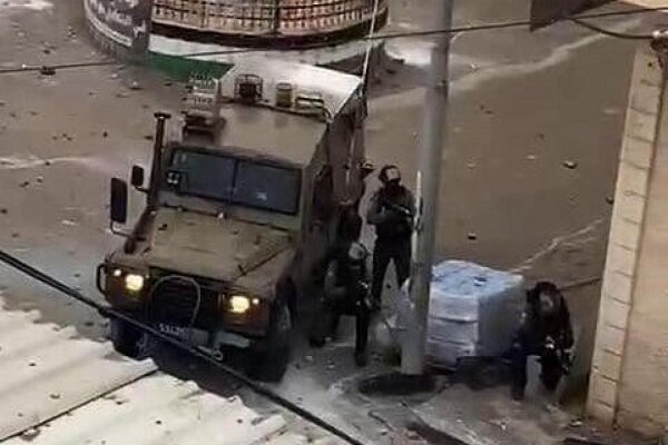 At least 13 Palestinian injured as Zionists raid refugee camp