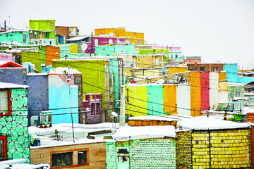 Colorful houses adorn deprived town