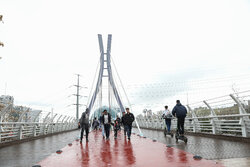 Tourists visit Nature Bridge in Tehran during Nowruz