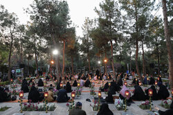 Iftar at cemetery alongside martyrs graves