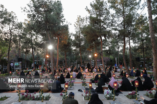 Iftar at cemetery alongside martyrs graves