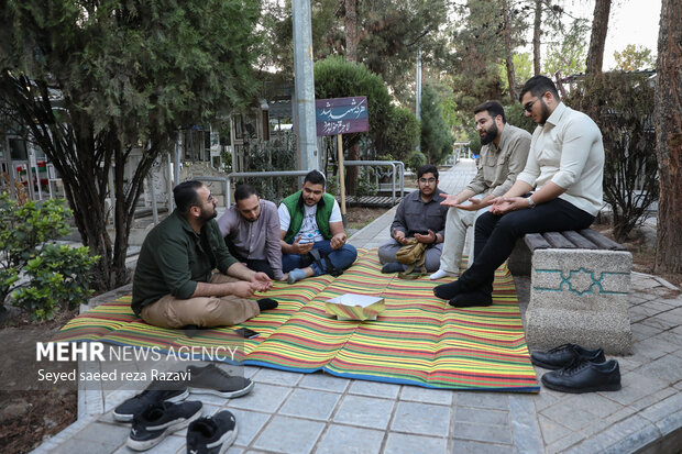 Iftar at cemetery alongside martyrs graves