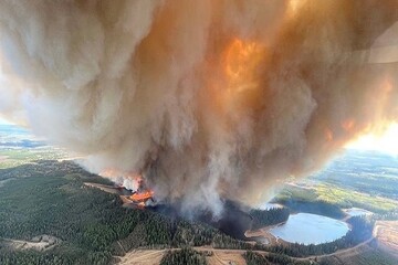 13,000 forced to evacuate as wildfires ravage western Canada