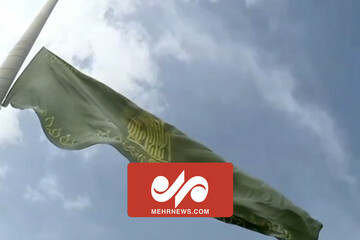 آئین اهتزاز بزرگترین پرچم مزین به نام امام رضا (ع) در همدان