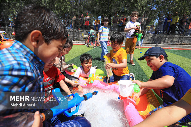 Children in Zanjan enjoy water play in Summer
