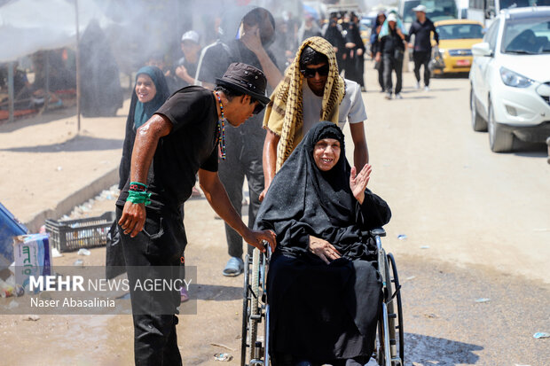 Arbaeen pilgrims walking toward Imam Hussein (AS) shrine
