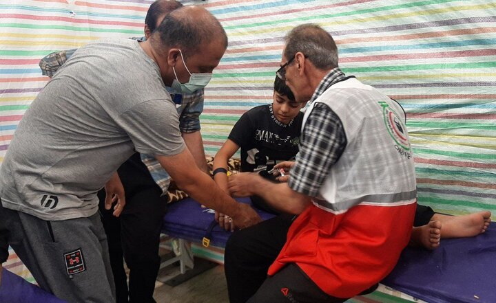 همکاری حشدالشعبی با هلال احمر در خدمترسانی به زائران