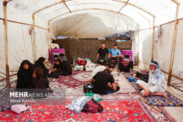 
Iraqi pilgrims holding Arbaeen trek