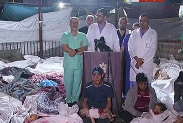 Screen grab captured from a video shows the doctors of the al-Shifa Hospital making a press statement among the corpses after the injured and dead are brought there following the Israeli attack on Gaza's Al-Ahli Baptist Hospital, in Gaza City, Gaza on October 17, 2023