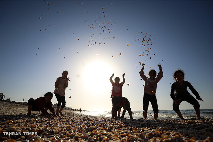 ‘Our only outlet’: Palestinians in Gaza go to the beach during Israel truce