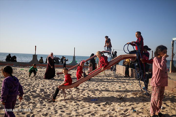 ‘Our only outlet’: Palestinians in Gaza go to the beach during Israel truce