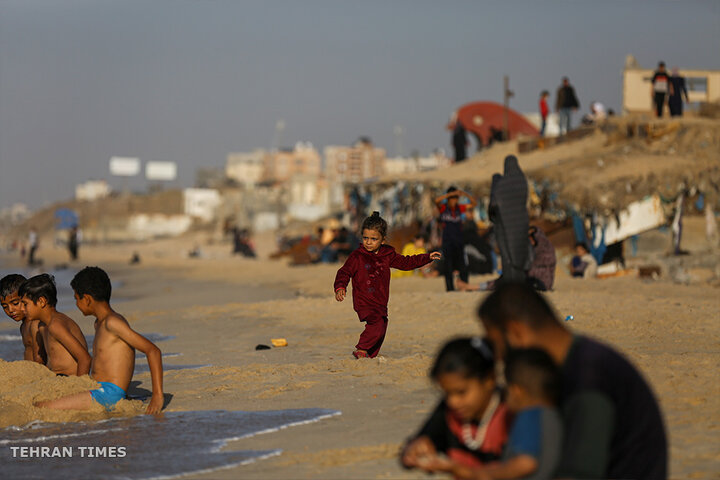 ‘Our only outlet’: Palestinians in Gaza go to the beach during Israel truce